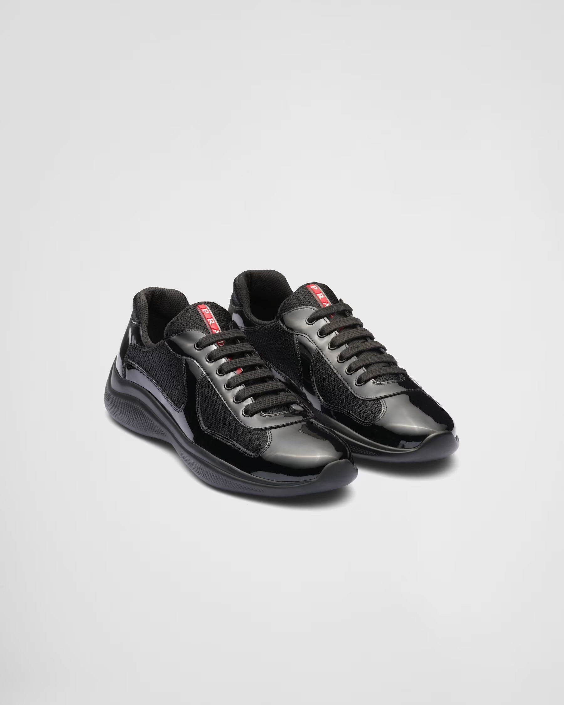 Prada Sneakers America’s Cup en cuir verni et tissu technique