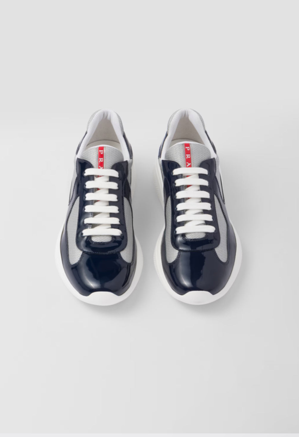 Prada Sneakers America’s Cup en cuir verni et tissu technique