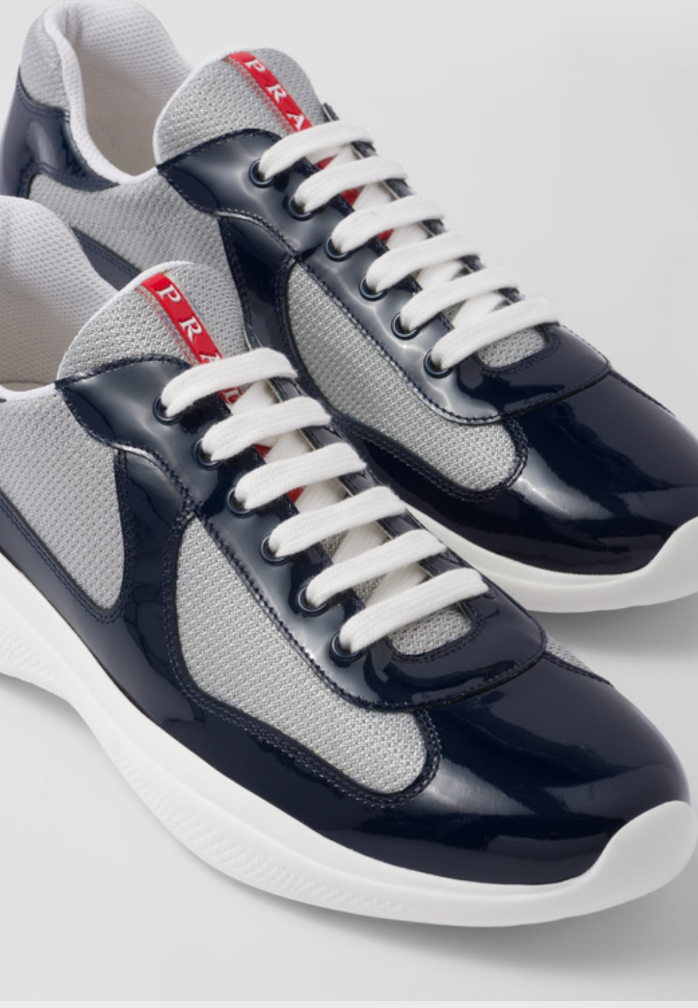 Prada Sneakers America’s Cup en cuir verni et tissu technique